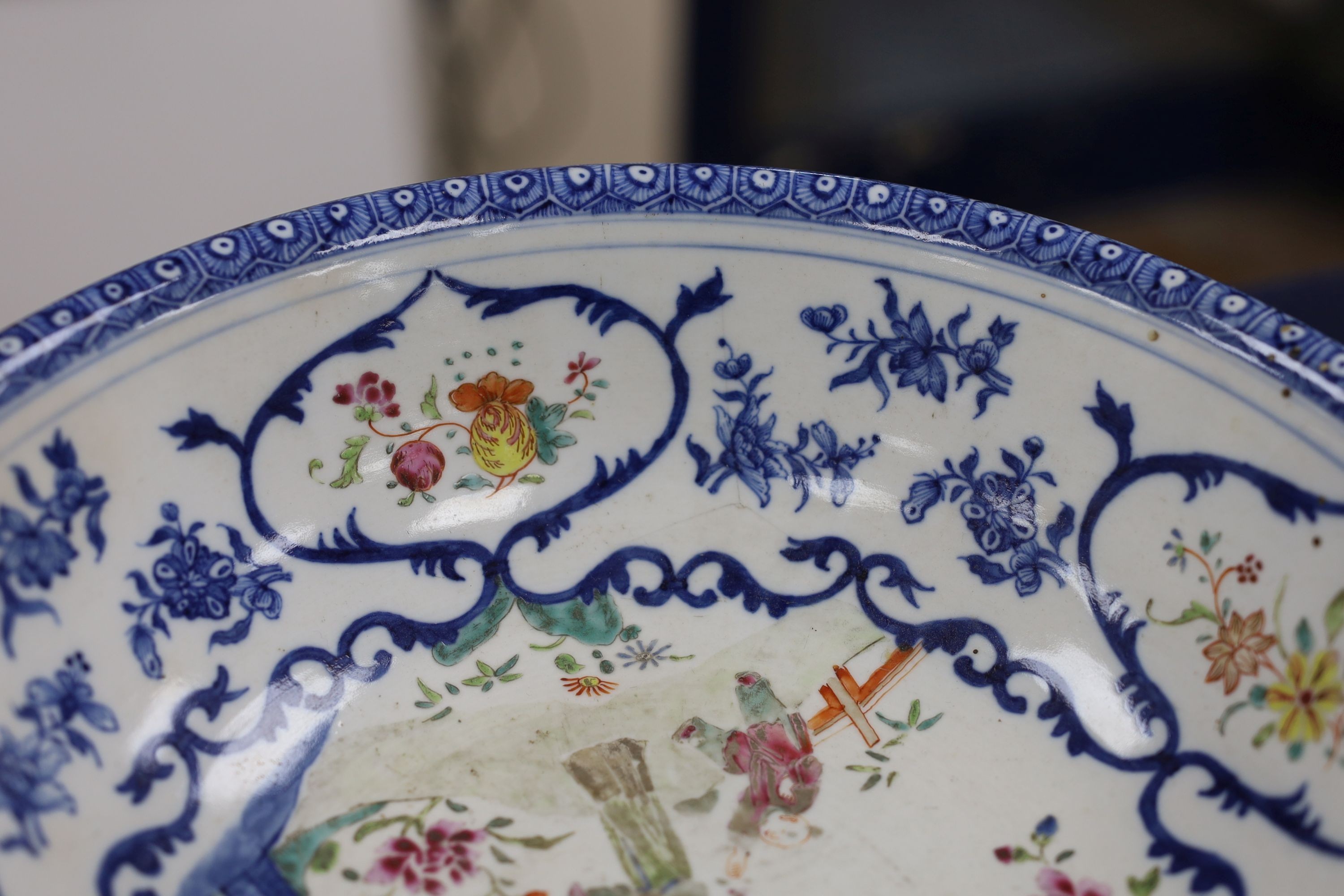 A Chinese underglaze blue and famille rose decorated basin or bowl, Qianlong period, 27 cm diameter